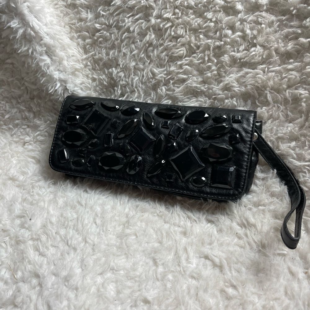 LULU Black faux leather wristlet embellished with black jewels.